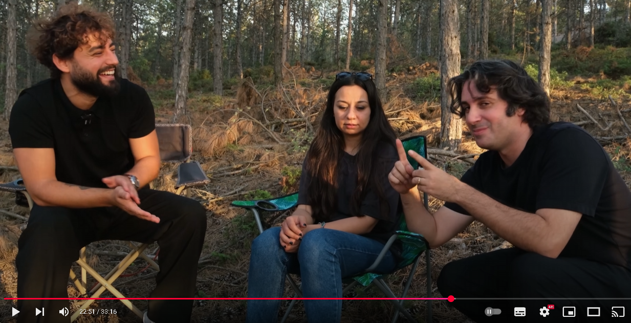When a bear came and attacked the woman, what strong and brave man strangled the bear to death, protected the woman, and celebrated his victory by smoking a cigarette over the bear's corpse?